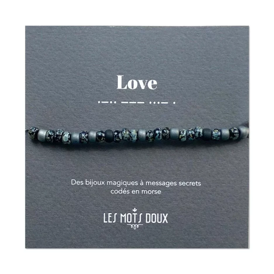 Bracelet morse Love. bracelet avec des perles noires, grises et bleues.